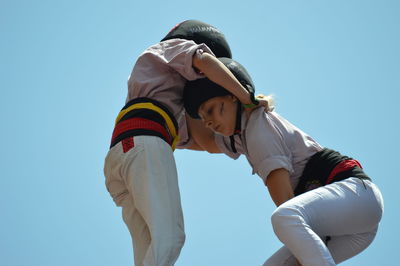 Low angle view of couple against sky