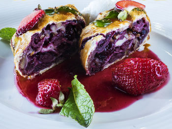 Close-up of strawberries and strudel in plate