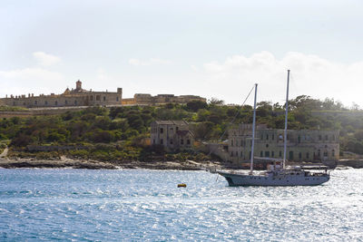 Beautiful sailboat on mediterranean sea with malta island on the background