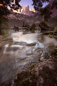 Scenic view of river flowing through rocks