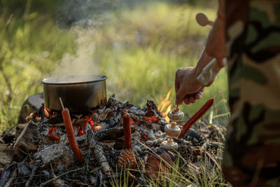 Midsection of man preparing food