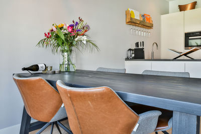 Potted plant on table against wall at home