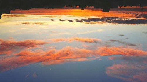 Scenic view of landscape against sky at sunset