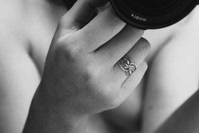 Close-up of woman with camera