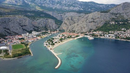 Omiš croatia drone photo. place where river cetina reaches the adriatic sea.
