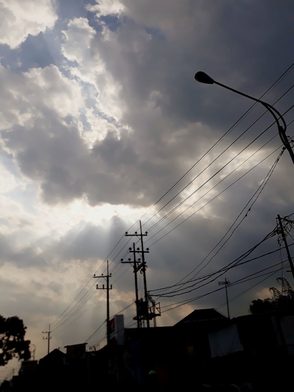 LOW ANGLE VIEW OF SILHOUETTE ELECTRICITY PYLON AGAINST SKY DURING SUNSET