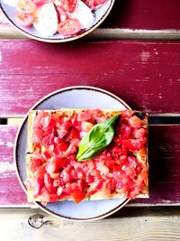 Directly above shot of pizza served on table