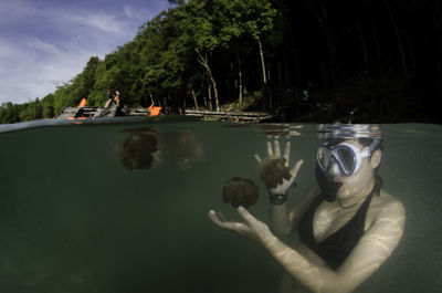 Woman snorkeling in lake