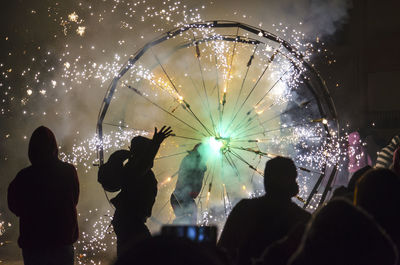 Group of people watching fire crackers