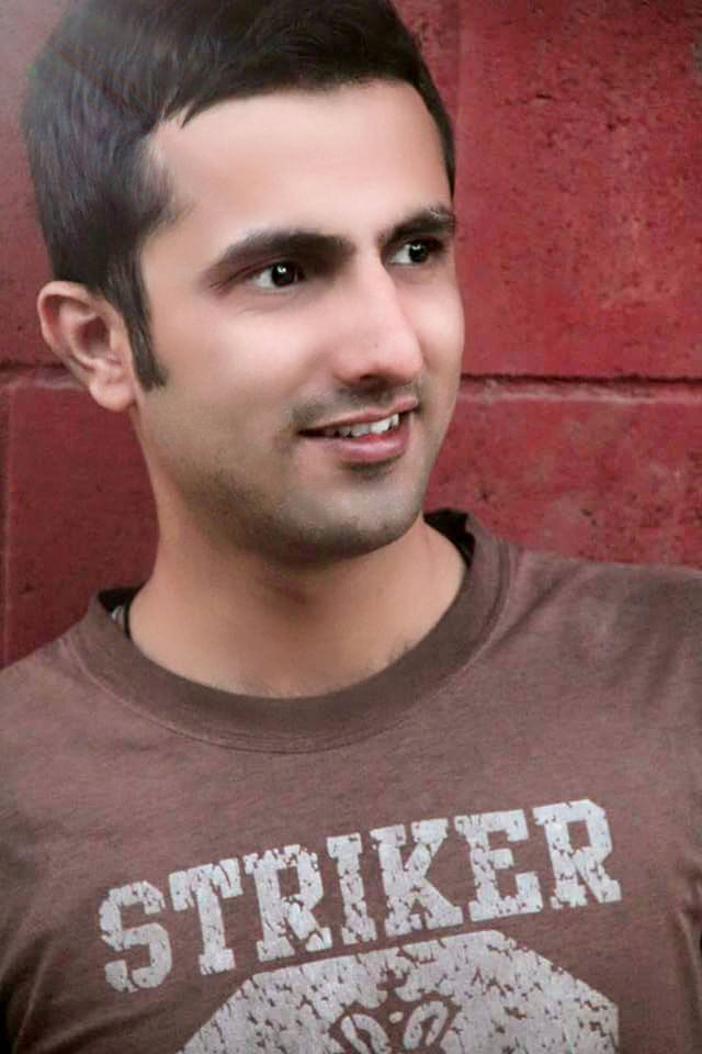 portrait, looking at camera, person, front view, lifestyles, young adult, indoors, casual clothing, headshot, smiling, leisure activity, close-up, young women, happiness, confidence, text, wall - building feature