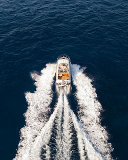 High angle view of ship sailing on sea