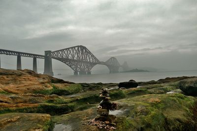 Bridge over sea against sky