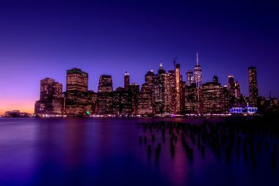 Illuminated buildings in city at night
