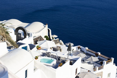 High angle view of tourist resort by sea during sunny day