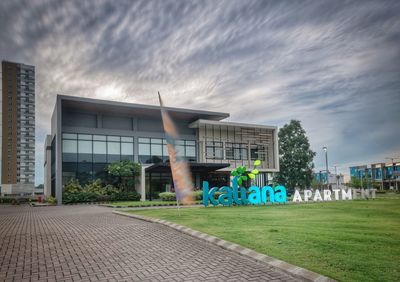 Exterior of building by street against sky