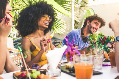 Young couple sitting on table at restaurant