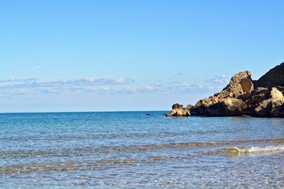 Scenic view of sea against blue sky