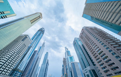 Low angle view of buildings against sky in city