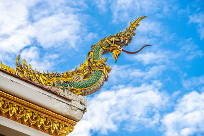 Low angle view of statue against sky