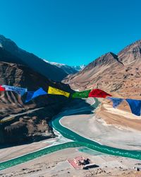 Scenic view of mountains against clear blue sky