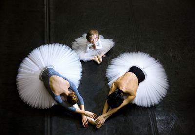 3 ballerinas on the background of the ballet floor