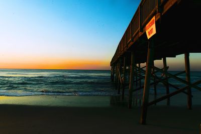 Scenic view of sea against clear sky during sunset