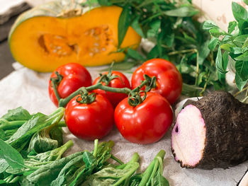 Close-up of tomatoes and fruits on table