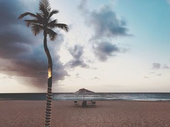 Scenic view of beach against sky during sunset