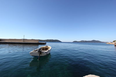 Scenic view of calm sea against clear sky