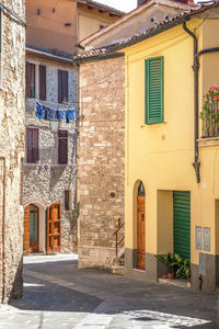 Siena province - view of narrow streets of the town, no people walking around  during midday siesta 