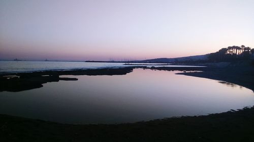 Scenic view of calm sea at sunset