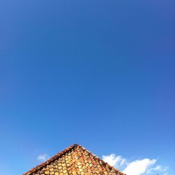 Low angle view of built structure against blue sky