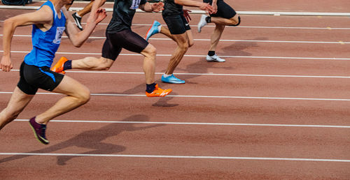 Low section of people playing soccer