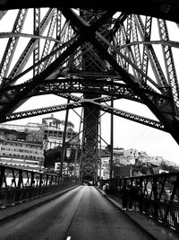 Bridge in city against sky