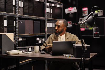 Man using laptop at office