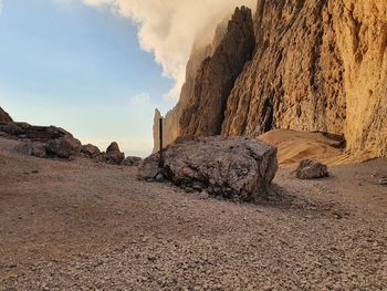 Rock formation on land against sky