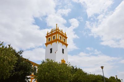 Low angle view of clock tower against sky