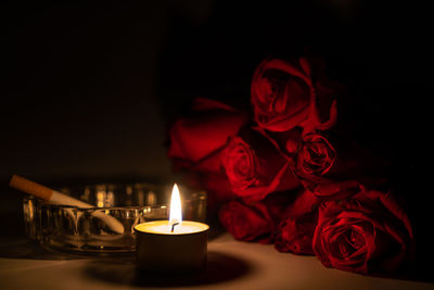 Close-up of red rose on table