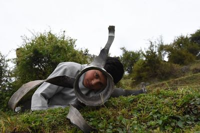 Portrait of smiling man lying on field