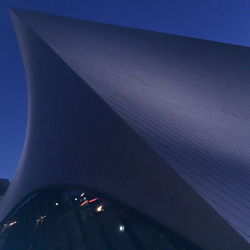 Low angle view of illuminated bridge against clear blue sky