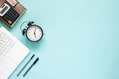 High angle view of clock on table