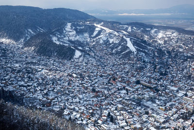 High angle view of snowcapped mountains against sky