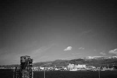 Abandoned built structure on beach against sky