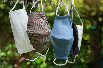 The fabric masks after washing and cleaning clamp on the clothes hanger because sunny to kill germs