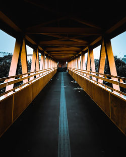 Bridge over footbridge against sky