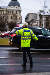 Rear view of man standing on street