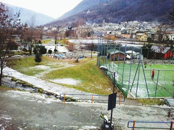 High angle view of houses and buildings against mountains