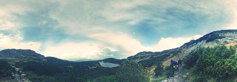 Countryside landscape against rocky mountains