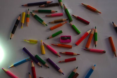 High angle view of colored pencils on table