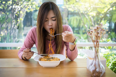Young woman eating food